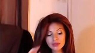Busty redhead sucks on dildo - porn video